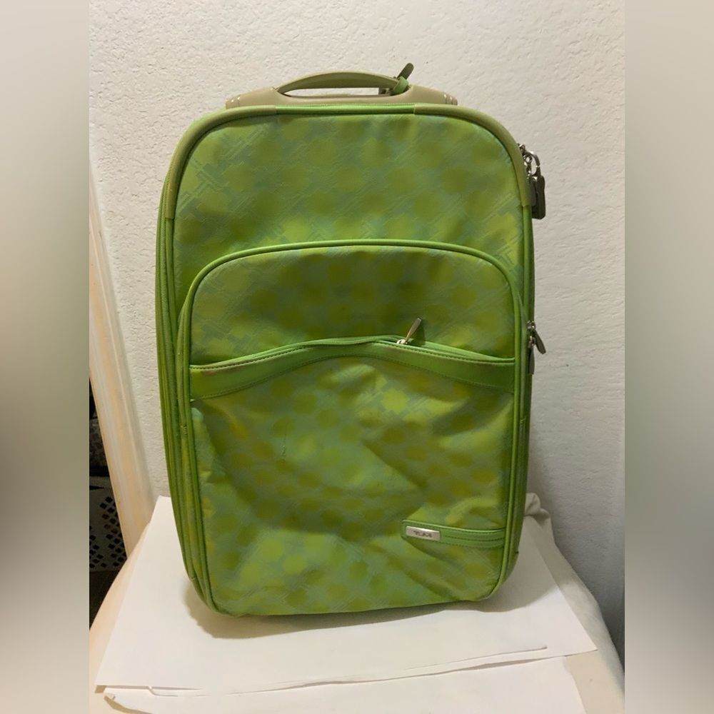 TUMI carry on expandable green roller bag